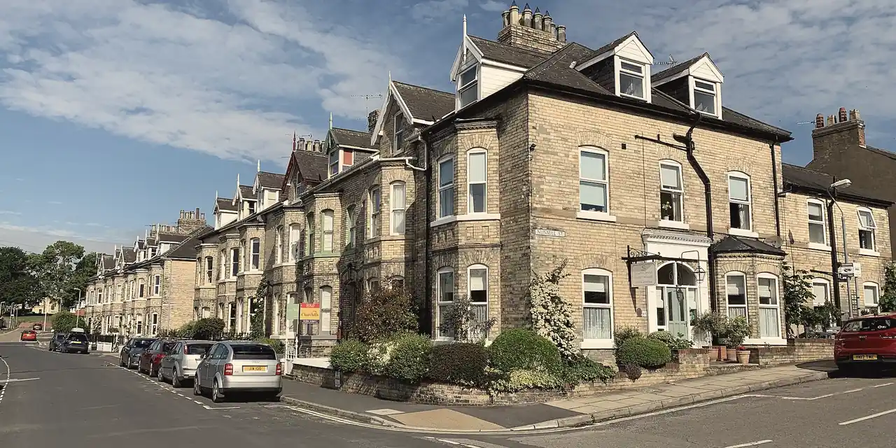 Terrace of Victorian bay-fronted villas with slate roofs, dormers and chimneys on Southlands Road, York